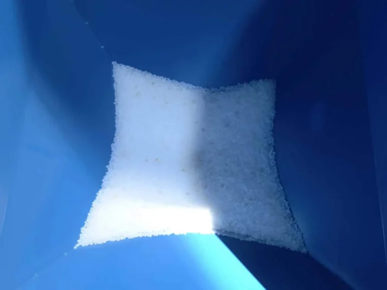 PE polyethylene resin pellets inside feeding hopper